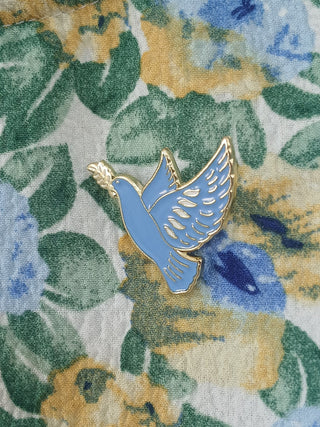 Pin’s colombe bleue émaillée – Caladia