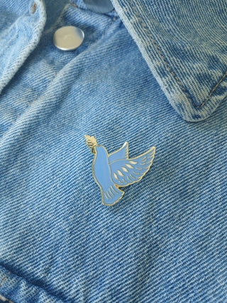 Pin’s colombe bleue émaillée – Caladia
